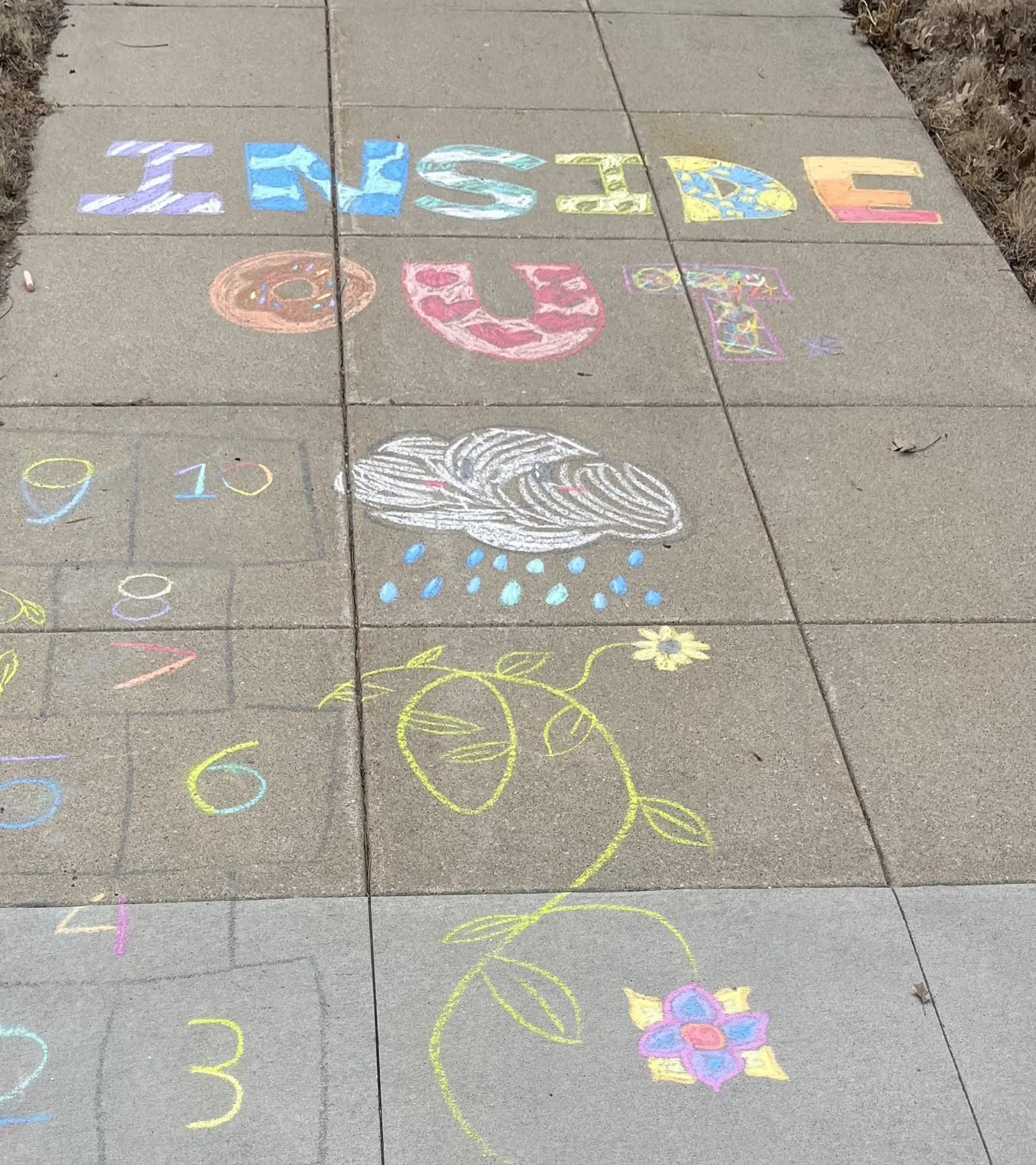 Inside Out chalk art created by team members